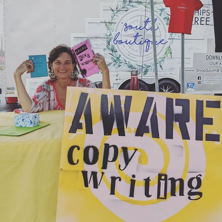Picture of Autumn Ware in her Aware Copywriting booth at a Carteret County Business Expo